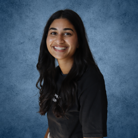 Asha smiling for a portrait