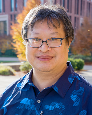 Bennett Yee smiling for a portrait