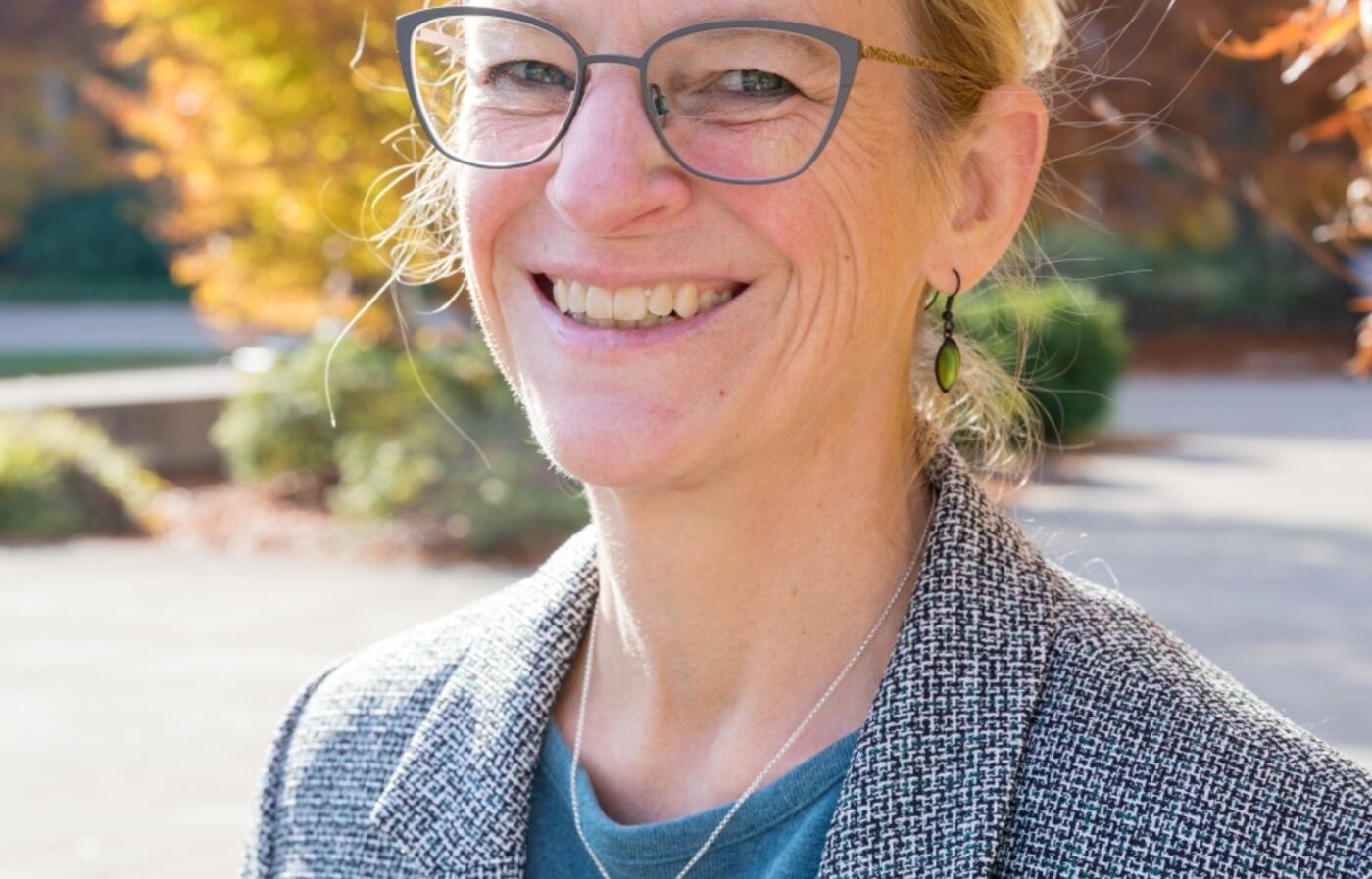Portrait of Troy Hall smiling.