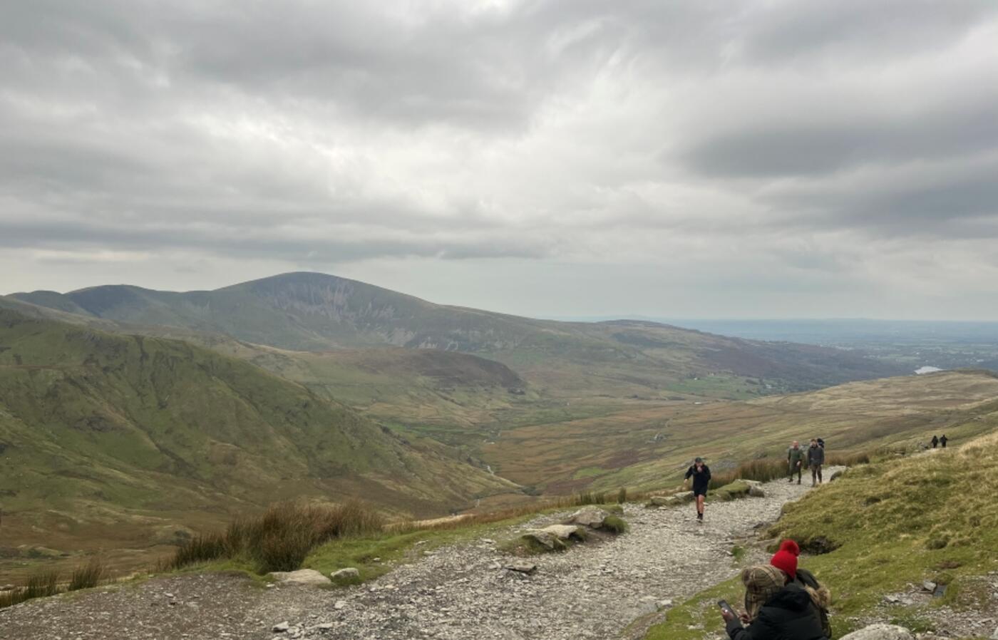 Hikers climb Snowdon Mountain, located near Bangor, Wales, U.K.