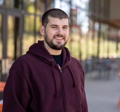Steven smiling for a portrait at OSU-Cascades