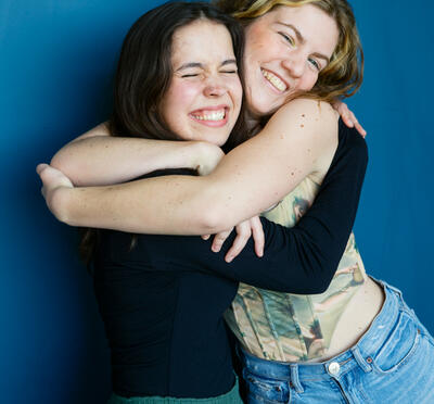 Kaitlyn and Frankie hugging and smiling for the camera