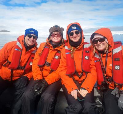 Keith and Dana Hammer with their two daughters in the bay off of Snow Hill Island, Antarctica