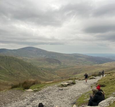 Hikers climb Snowdon Mountain, located near Bangor, Wales, U.K.