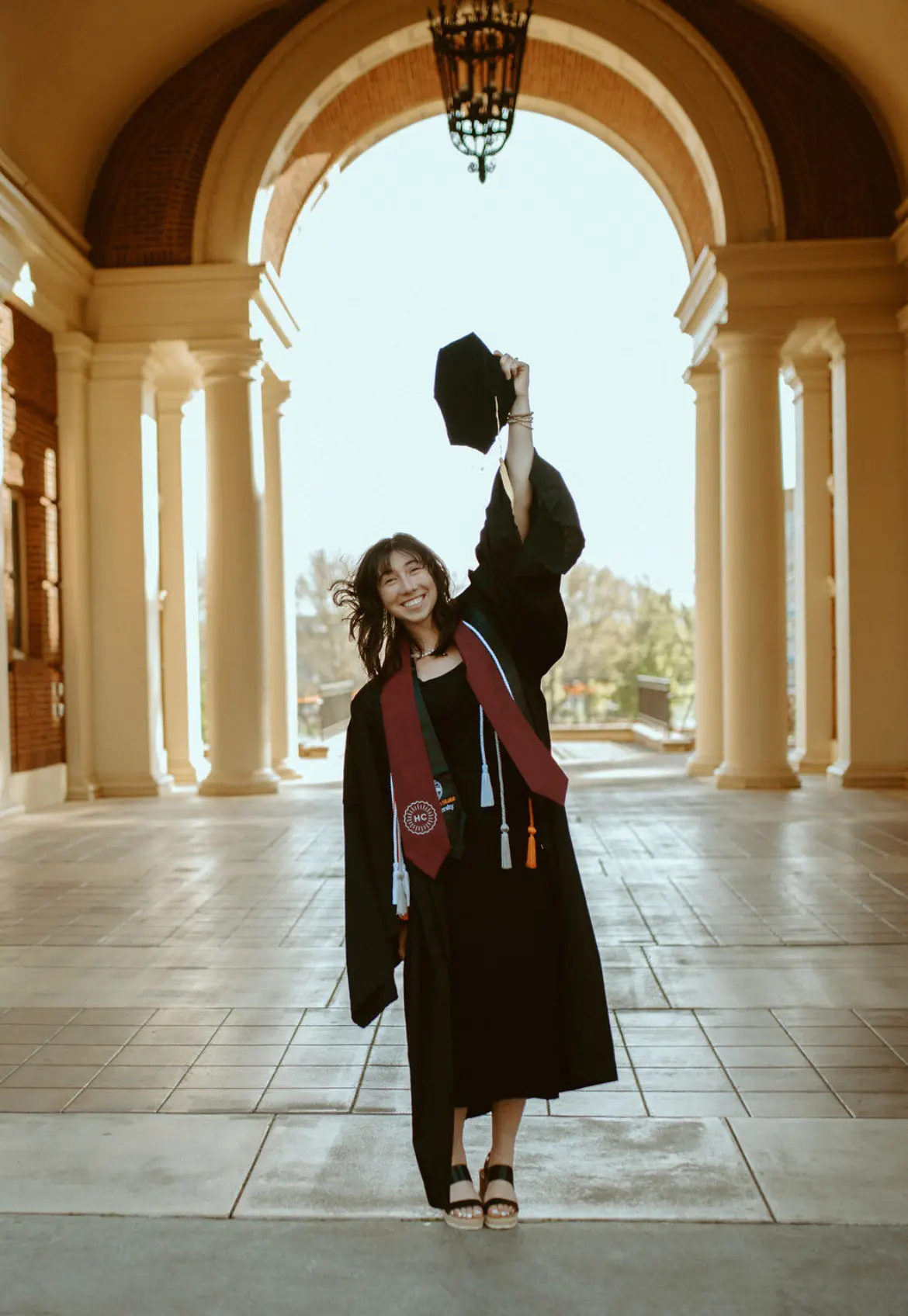 Carissa O’Donnell, '24, smiling in her OSU cap and gown