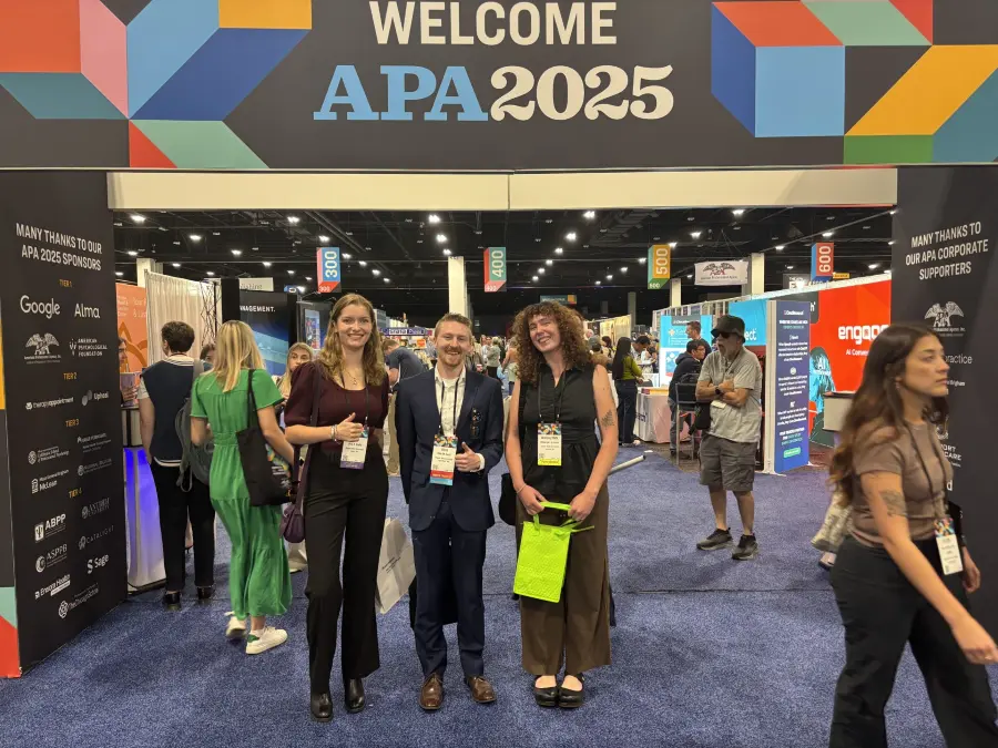 Madalynn alongside fellow researchers at the APA convention.