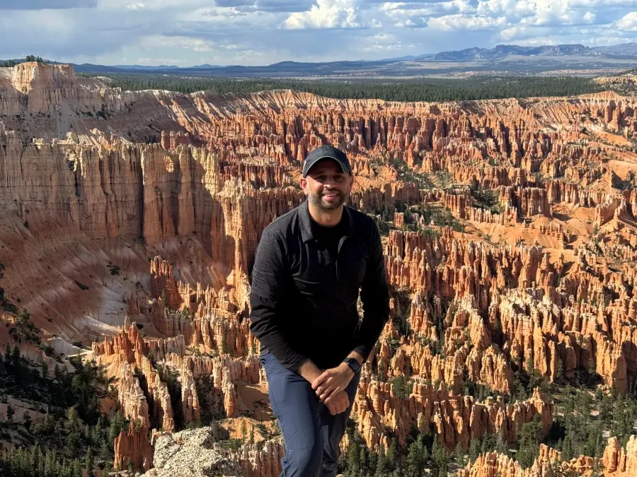 Ravi with a scenic view behind him.