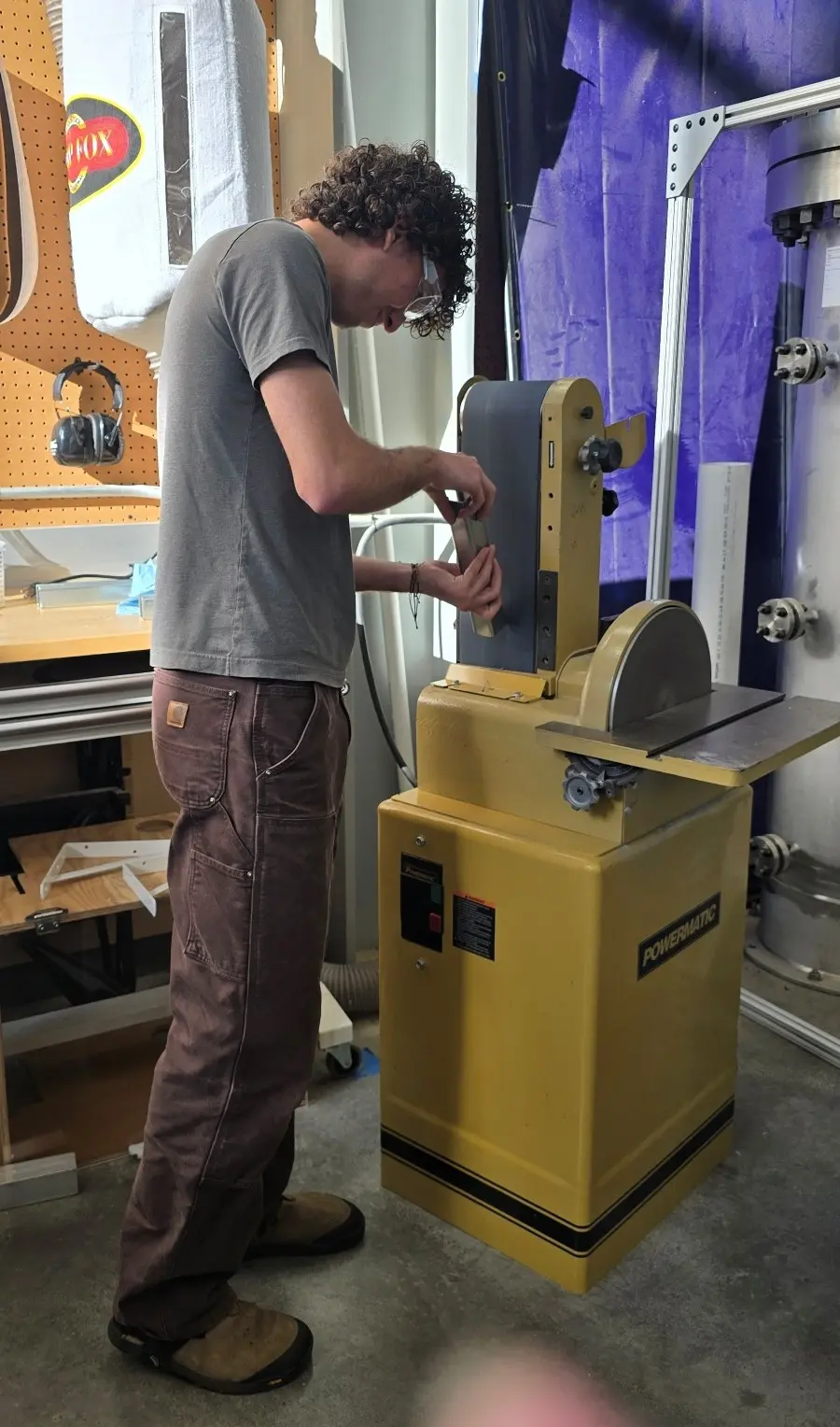 DSI student Henry Stewart Timarchi works on fabricating exhibit components during the ARTEx + Hatfield team’s installation field trip to Hatfield Marine Science Center.