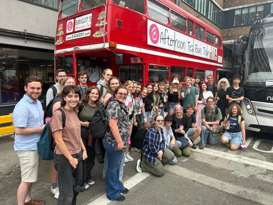 The group gathers for a photo with their tea at the conclusion of their Afternoon Tea Bus Tour. 