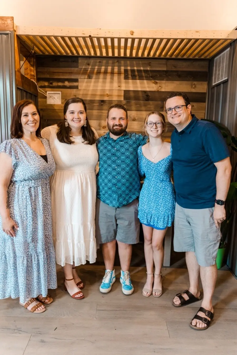 Taylor and her husband posing with their friends.