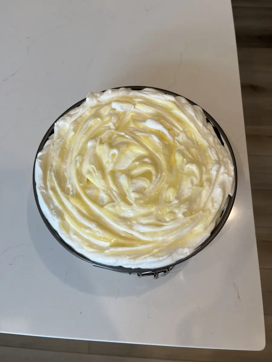 Lemon poppy seed cheesecake with whipped cream and lemon curd pie from Fiona's cookbook.