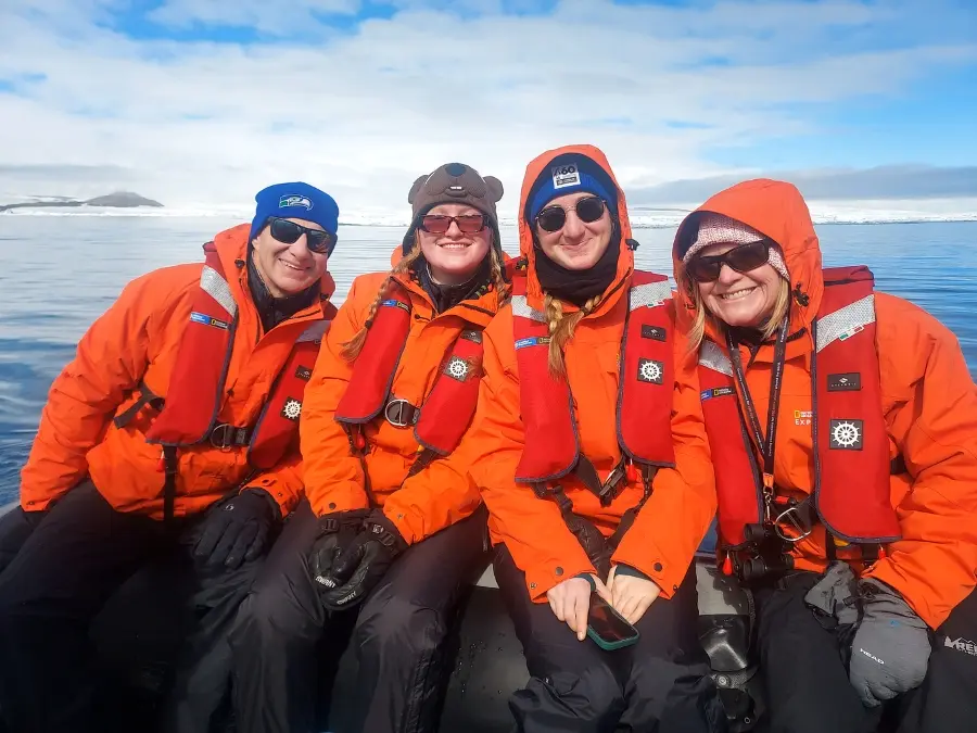 Keith and Dana Hammer with their two daughters in the bay off of Snow Hill Island, Antarctica