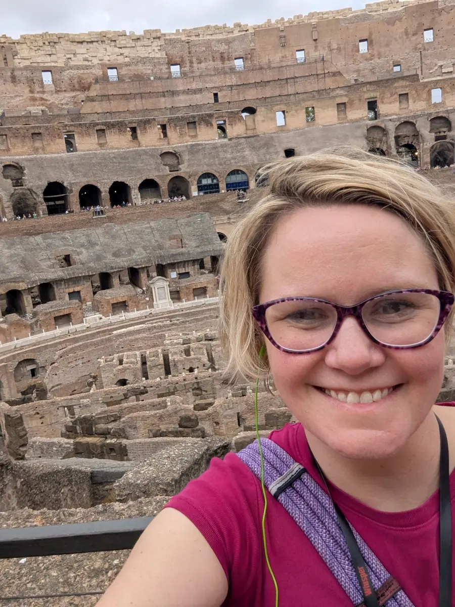 Megan smiling with the Coliseum in the background.
