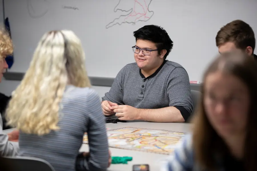 Students in the Exploring Commerce Through Board Games seminar course playing Ticket to Ride