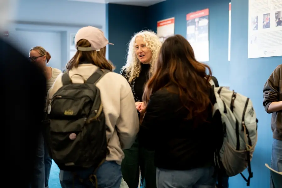 Katherine Hubler talks to students during the course's Thrift and Repair Fair on March 4, 2026.