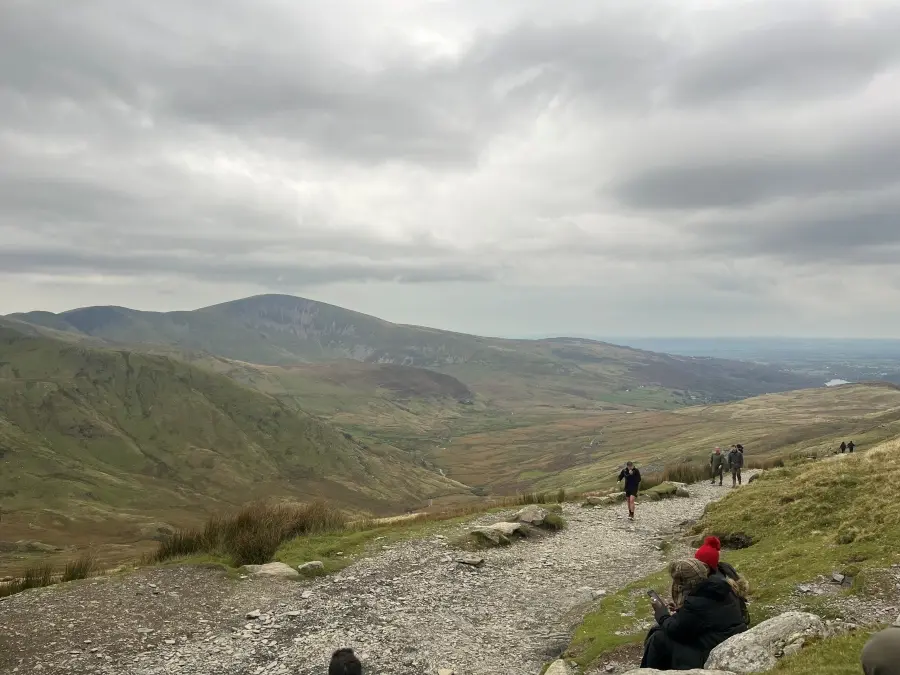 Hikers climb Snowdon Mountain, located near Bangor, Wales, U.K.