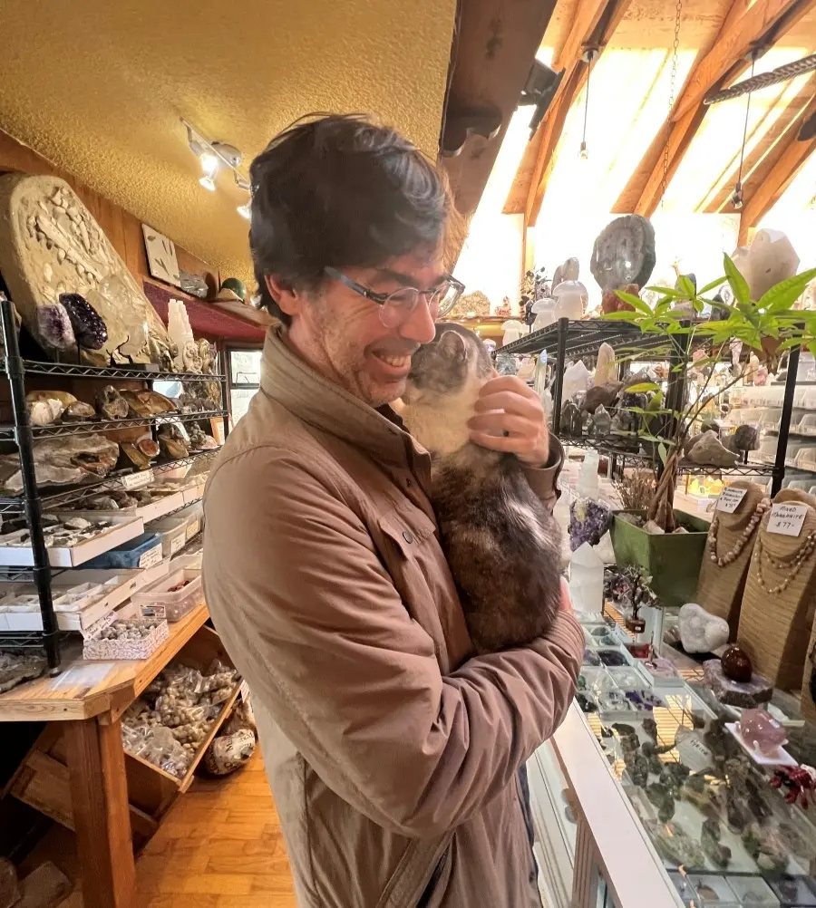 Beau Baca holding a cat.