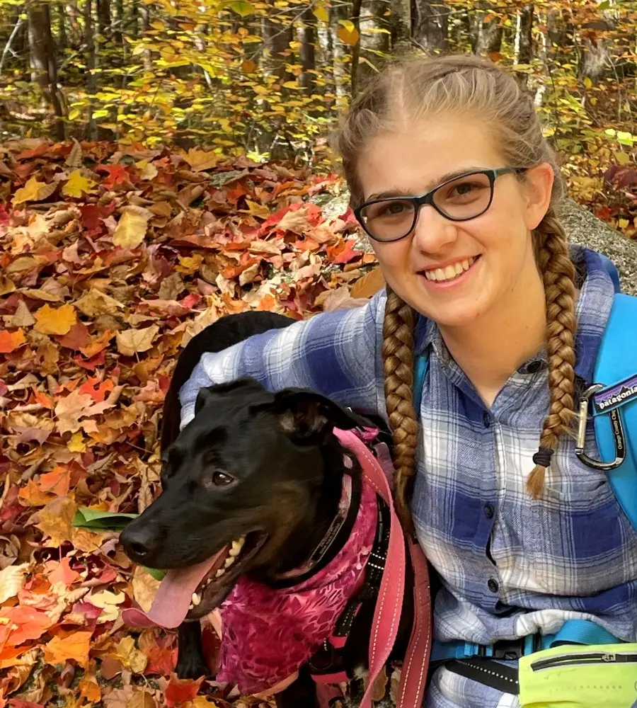 Jessica Flesher smiling with her dog.