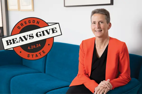 Dean Doolen sits on a blue couch with an OSU logo superimposed
