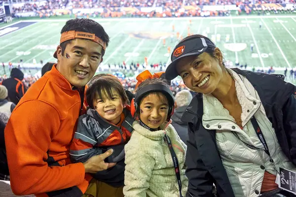 Bory with her kids at an OSU football game