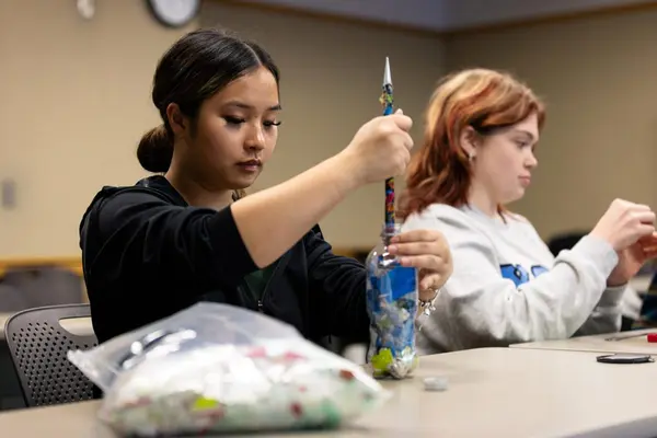 OSU students Shirley Chen (left) and Katie Wagner assemble ecobricks in the Agriculture and Life Sciences building on Jan. 30, 2025.