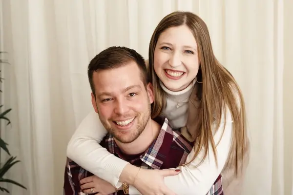 Katelyn smiling with her husband.