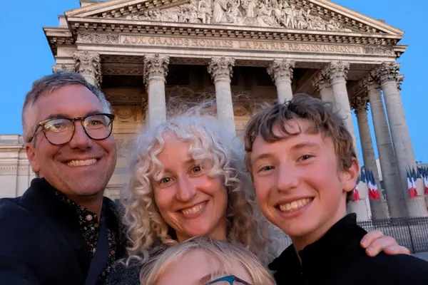 Kevin with his wife and two sons in France.