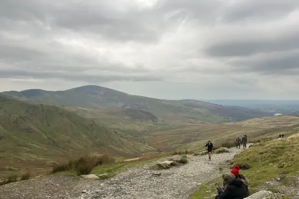 Hikers climb Snowdon Mountain, located near Bangor, Wales, U.K.