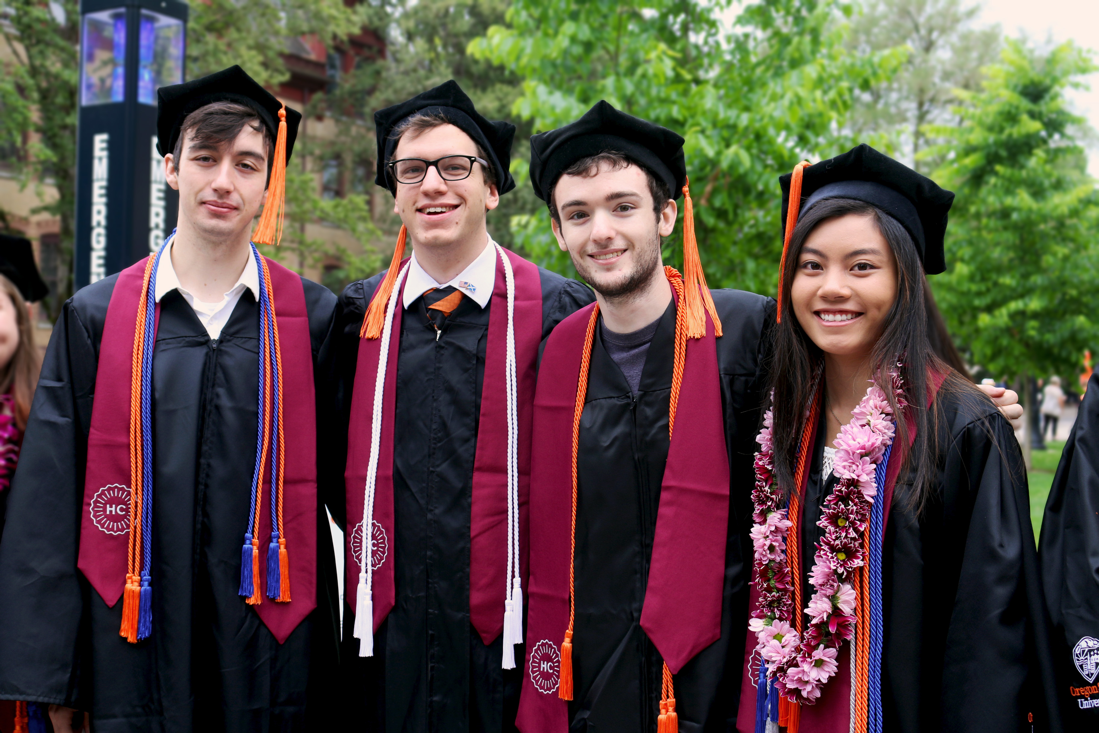 Honors College students wearing the graduation regalia